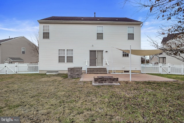 back of house with a patio and a lawn