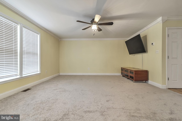 unfurnished living room with carpet flooring, ceiling fan, and crown molding