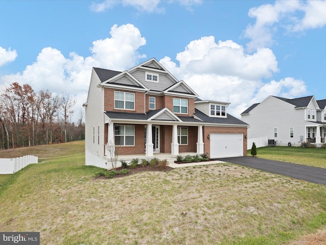 craftsman inspired home with a front lawn and a porch