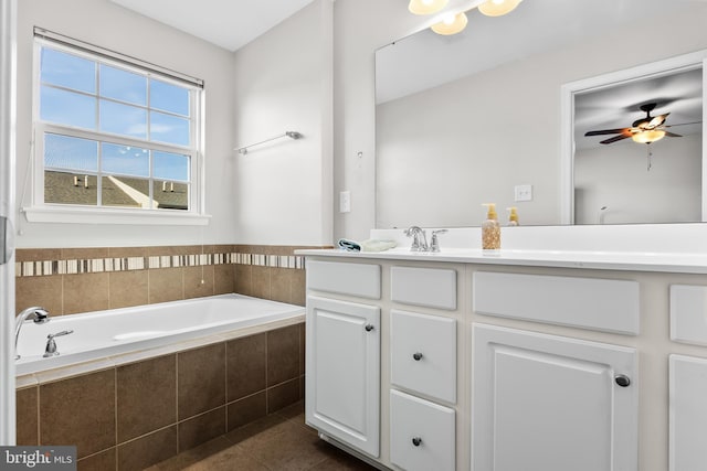 full bathroom with tile patterned flooring, ceiling fan, vanity, and a bath