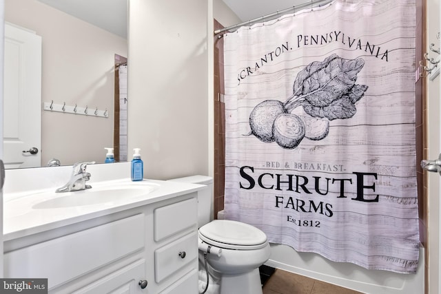 full bath featuring toilet, shower / bath combo, vanity, and tile patterned floors