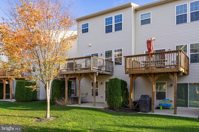 back of house with a yard and a wooden deck