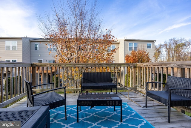 wooden deck with an outdoor hangout area