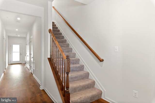 stairway featuring hardwood / wood-style flooring