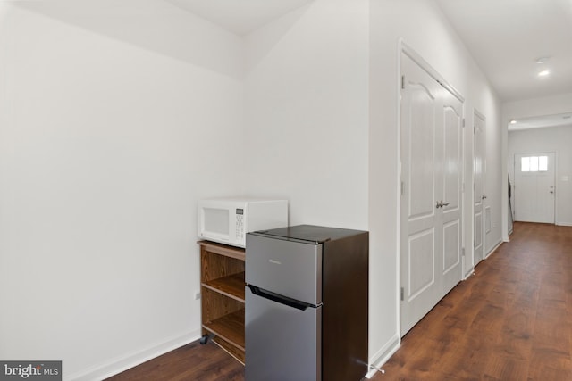 corridor featuring dark hardwood / wood-style floors