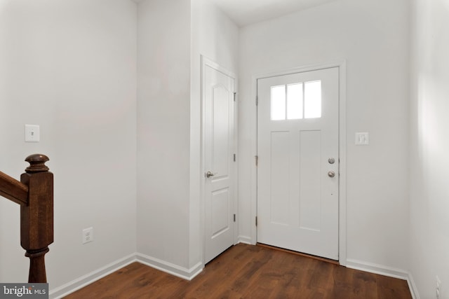 entrance foyer featuring dark hardwood / wood-style floors