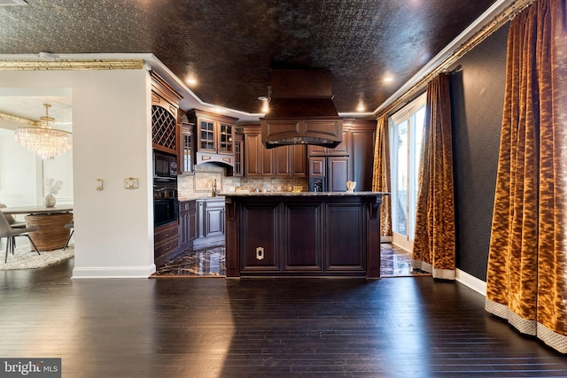 kitchen with ornamental molding, dark wood-type flooring, premium range hood, and black appliances