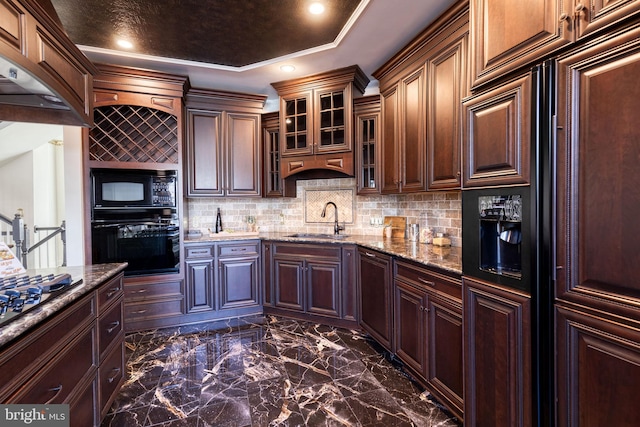 kitchen featuring sink, decorative backsplash, black appliances, and dark stone counters