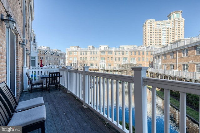 balcony featuring a water view