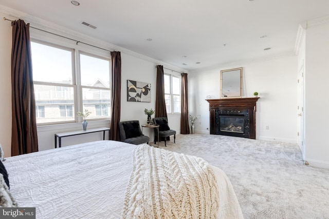 carpeted bedroom featuring crown molding