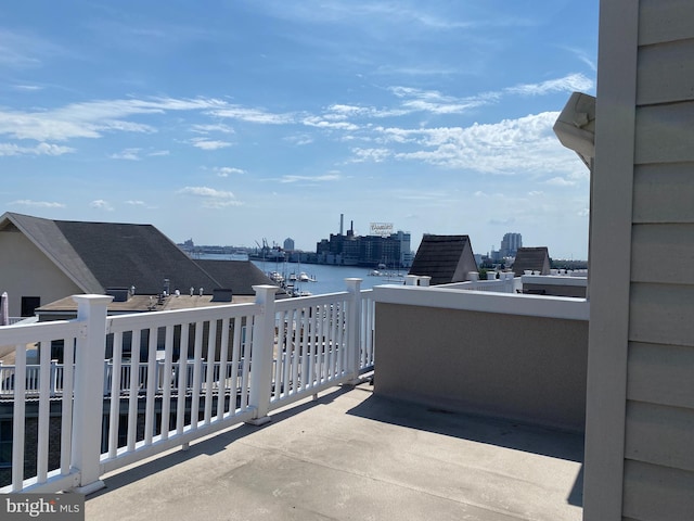 balcony featuring a water view