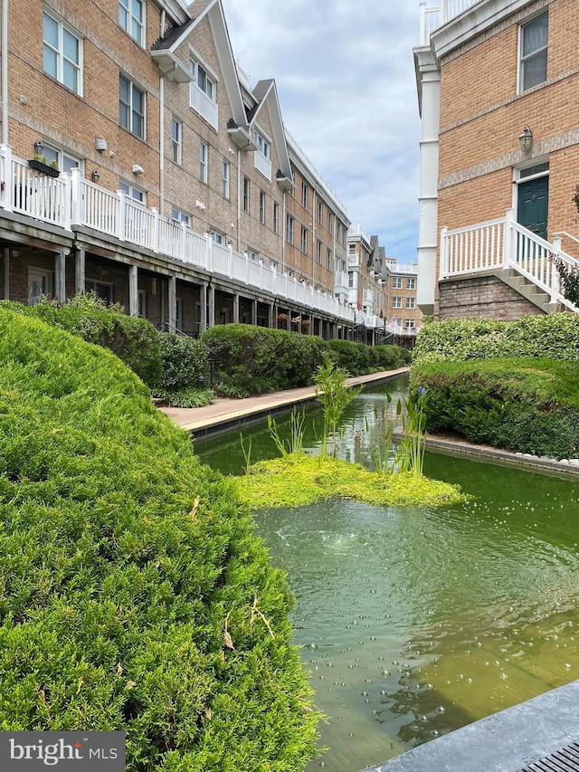 view of home's community with a water view