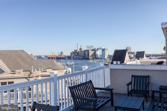 balcony featuring a water view