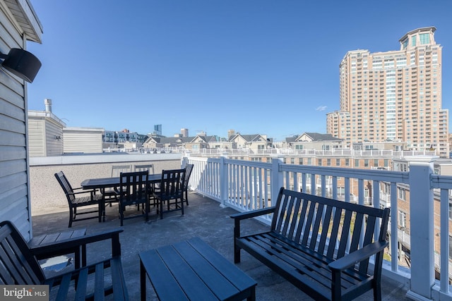 wooden terrace featuring a patio area