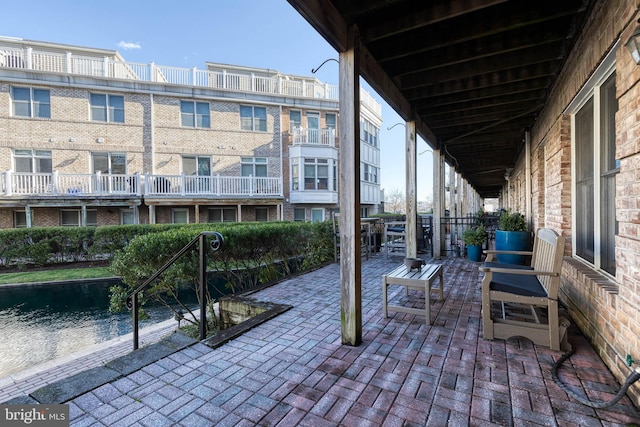 view of patio / terrace featuring a water view