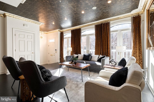 living room featuring crown molding and hardwood / wood-style floors