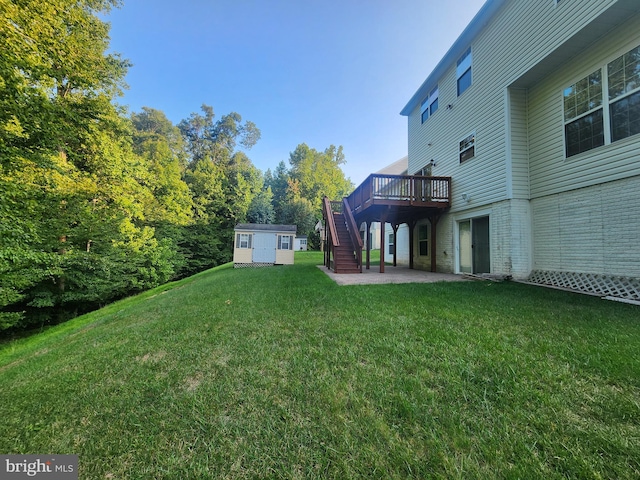 view of yard featuring a shed and a deck