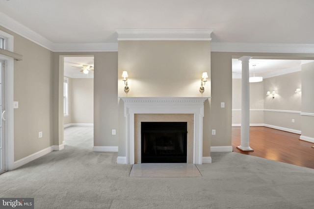 unfurnished living room featuring decorative columns, crown molding, ceiling fan, and light carpet