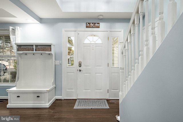 13801 Fountain Rd, Ocean City, MD 21842 - foyer featuring dark wood-style flooring, healthy amount of natural light, stairs, and baseboards