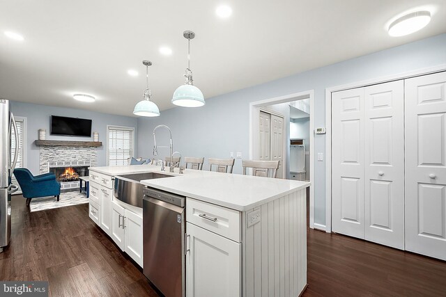 13801 Fountain Rd, Ocean City, MD 21842 - kitchen with appliances with stainless steel finishes, a sink, dark wood-style flooring, open floor plan, and white cabinets