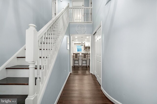 13801 Fountain Rd, Ocean City, MD 21842 - stairway with a towering ceiling and wood finished floors