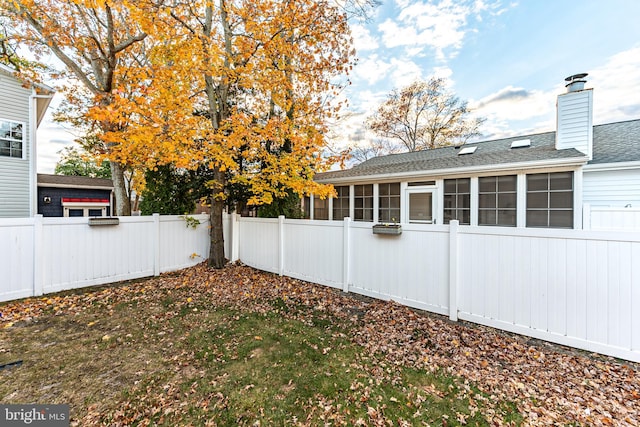 view of yard featuring a sunroom