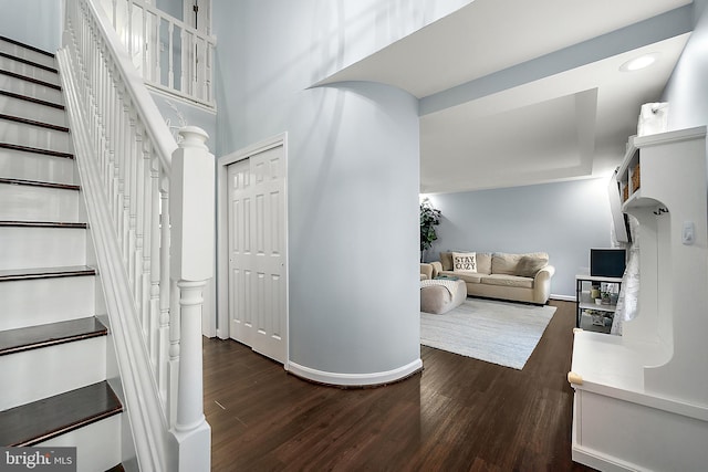 hallway with dark wood-type flooring