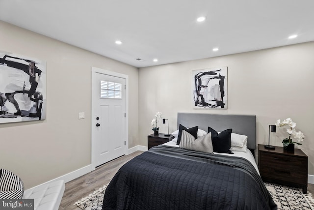 bedroom with light hardwood / wood-style flooring