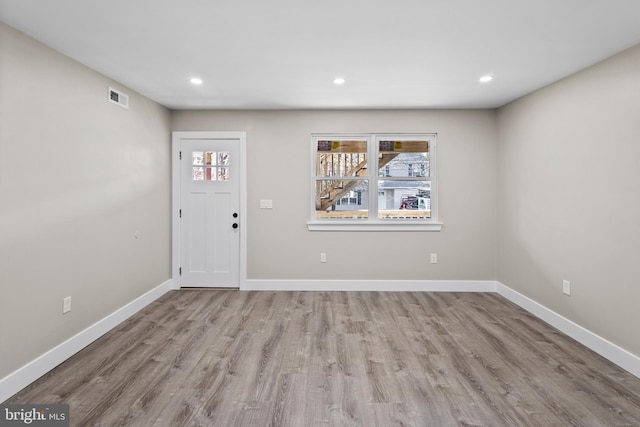 foyer with light wood-type flooring