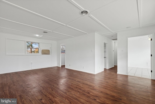 empty room with dark hardwood / wood-style flooring