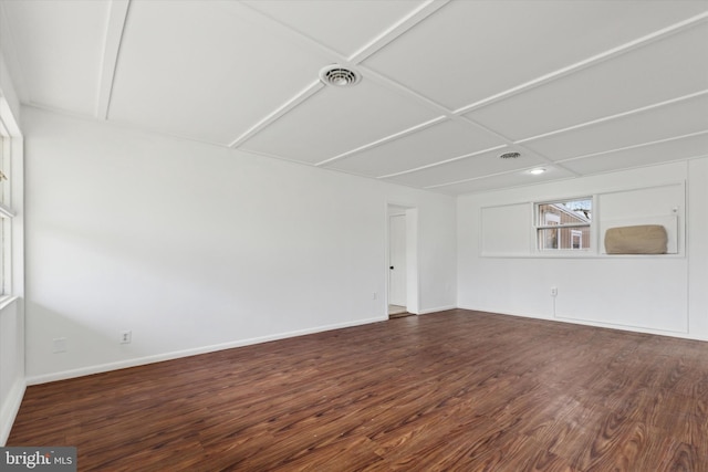 empty room featuring dark wood-type flooring