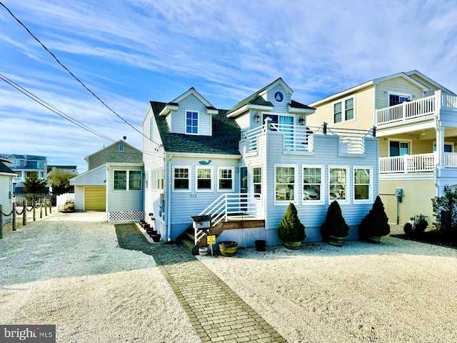 view of front of property featuring a balcony