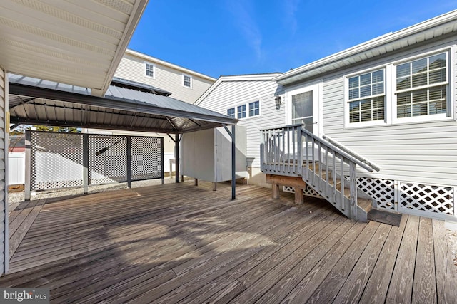 wooden terrace featuring a gazebo