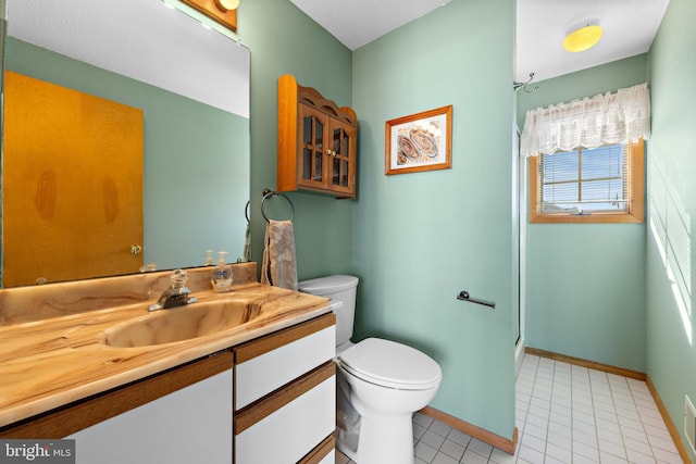 bathroom featuring tile patterned floors, an enclosed shower, vanity, a textured ceiling, and toilet