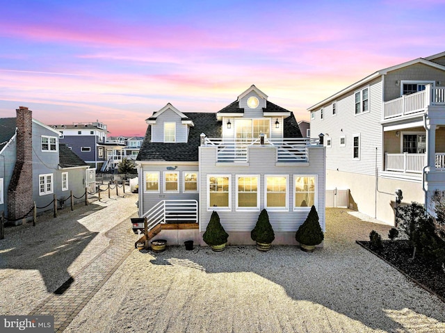 view of front of property featuring a balcony