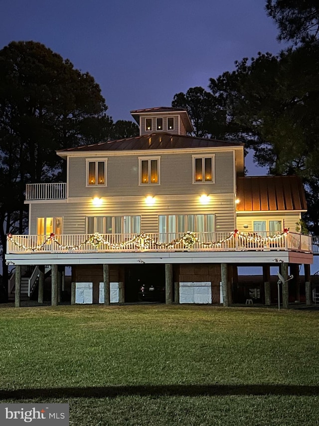 back of house with a yard and a deck