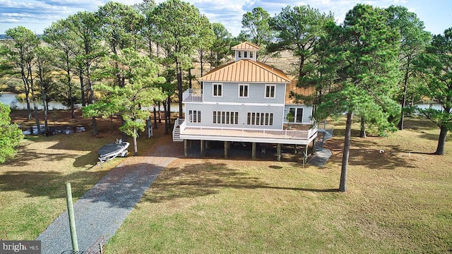 back of house with a yard and a deck