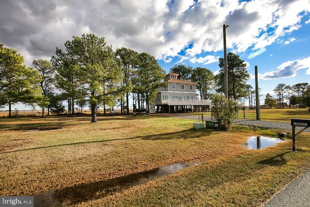 view of property's community with a yard