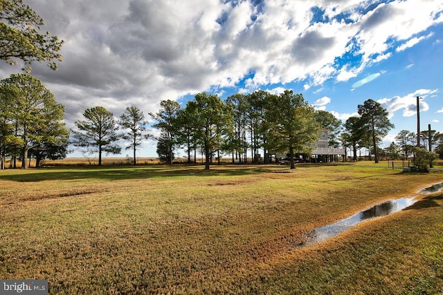 view of home's community featuring a lawn