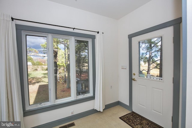 entryway featuring light tile patterned floors