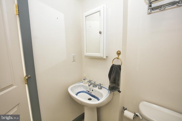 bathroom with sink and toilet