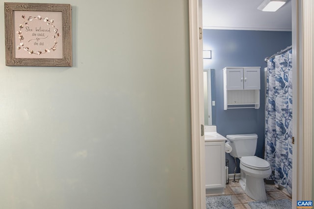 bathroom with tile patterned floors, vanity, and toilet