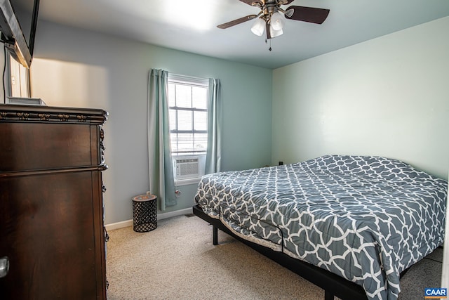 carpeted bedroom with ceiling fan and cooling unit