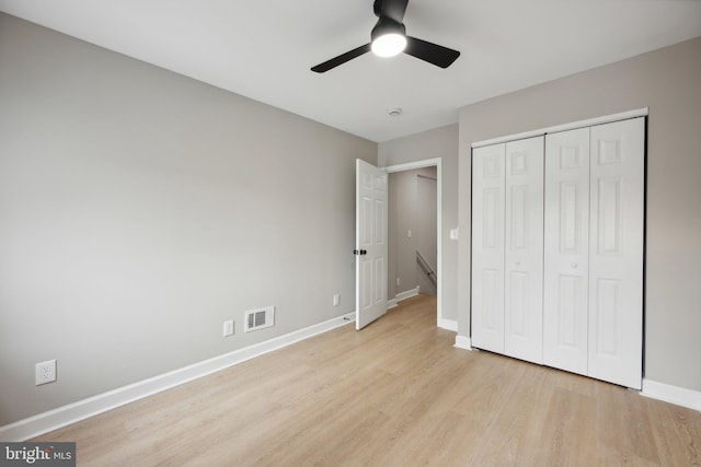 1155 Washington Blvd, Baltimore, MD 21230 - unfurnished bedroom with light wood-style floors, baseboards, a closet, and ceiling fan