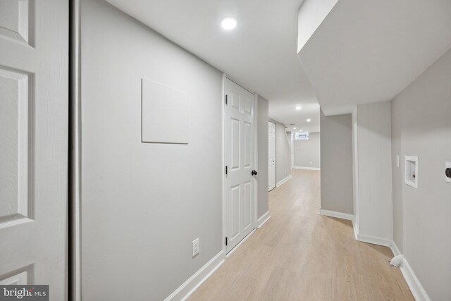 hall with light wood-type flooring