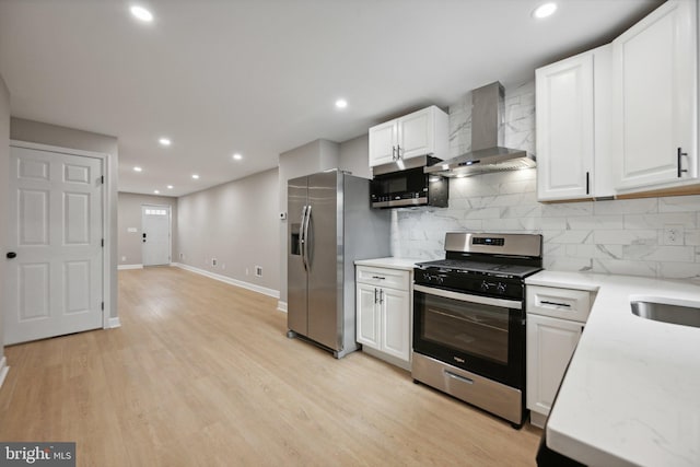 1155 Washington Blvd, Baltimore, MD 21230 - kitchen with stainless steel appliances, wall chimney exhaust hood, baseboards, backsplash, and recessed lighting