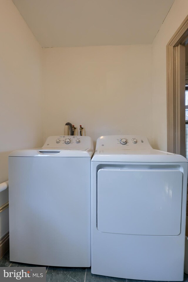 laundry area with separate washer and dryer