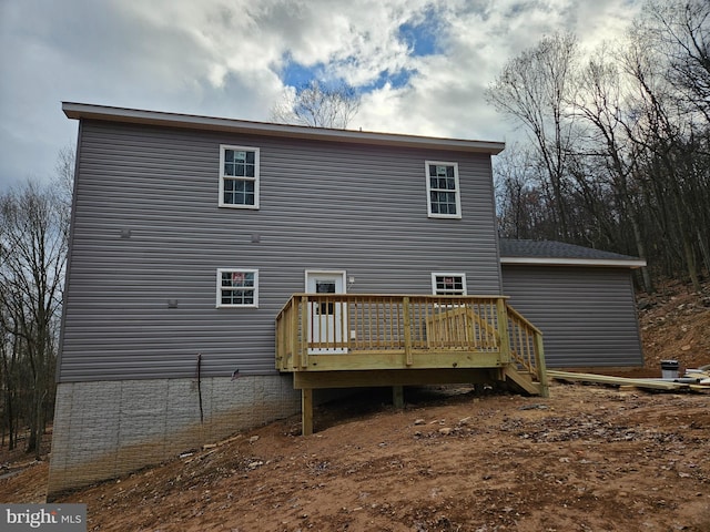 back of property with a deck