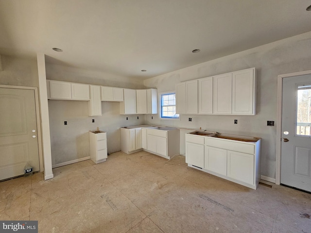 kitchen featuring white cabinetry and a healthy amount of sunlight