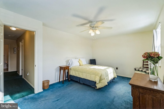 carpeted bedroom featuring ceiling fan